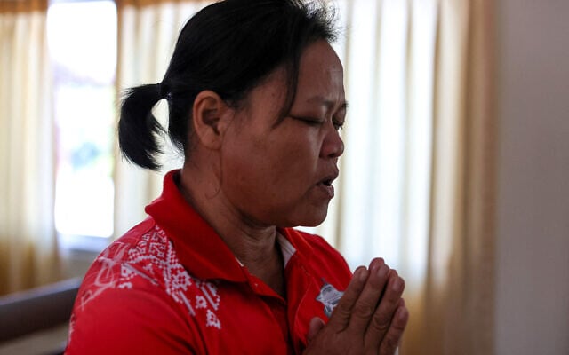 Wiwwaro Sriaoun, 53, a mother of a remaining Thai hostage captured by Hamas, Watchara Sriaoun, attends Sunday church service, in Kut Yang village, Udon Thani province, Thailand, October 6, 2024. (REUTERS/Thomas Suen) Wiwwaro Sriaoun, 53, a mother of a remaining Thai hostage captured by Hamas, Watchara Sriaoun, attends Sunday church service, in Kut Yang village, Udon Thani province, Thailand, October 6, 2024. (REUTERS/Thomas Suen)