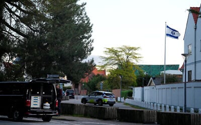 A police vehicle is seen as police officers investigate two blasts near the Israeli embassy in Copenhagen, Denmark, October 2, 2024. (Ritzau Scanpix/via Reuters)