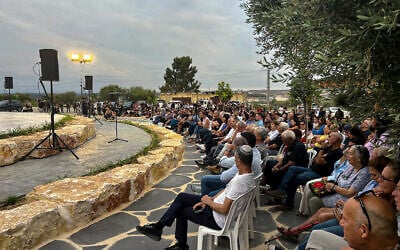 A ceremony at Netiv Ha'asara on October 6, 2024, commemorating the 20 residents who were slain by Hamas on October 7, 2023 (Shalom Yerushalmi / Times of Israel)
