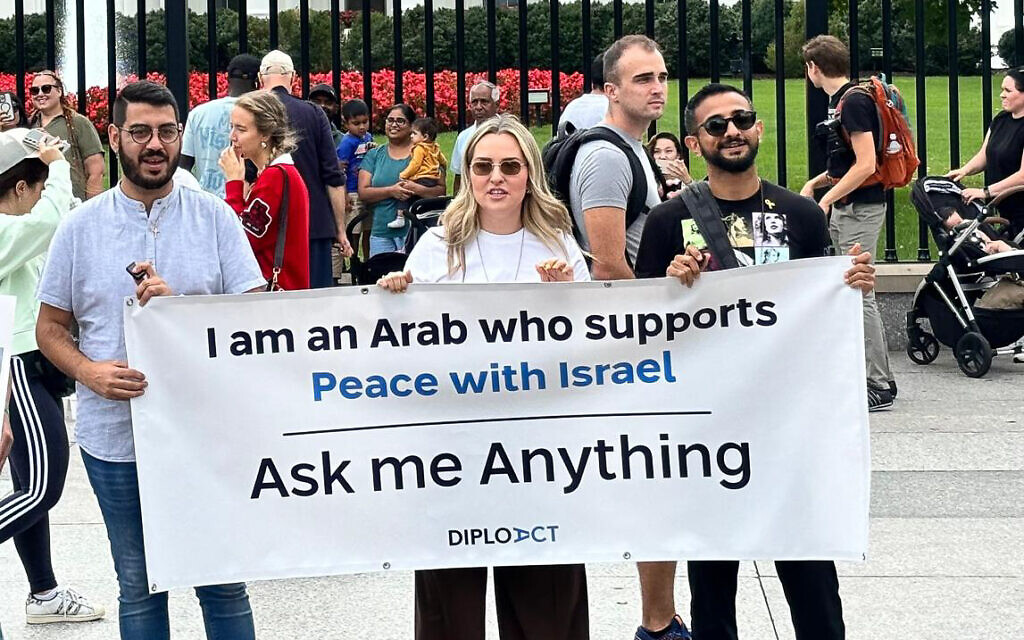 Jonathan Elkhoury (left), who escaped Lebanon as a refugee with his family, former SLA members, when he was nine, stands in front of the White House at a pro-Israel rally in September 2024. (Courtesy)