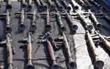 Weapons seized from the Hamas terror group are presented for display to foreign journalists and others on the first anniversary of the group's October 7, 2023 attack. (Israel Defense Forces)