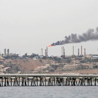 A picture taken on March 12, 2017, shows an oil facility in the Khark Island, Iran, on the shore of the Gulf. (Atta Kenare/ AFP)