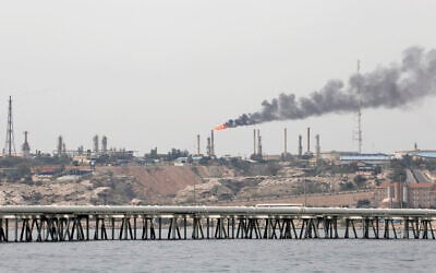 A picture taken on March 12, 2017, shows an oil facility in the Khark Island, Iran, on the shore of the Gulf. (Atta Kenare/ AFP)
