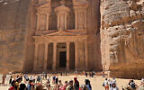 Tourists visit the site of al-Khazneh (Arabic for treasury), in the ruins of the ancient Nabatean city of Petra in southern Jordan on September 28, 2022. (Photo by Daniel SLIM / AFP)