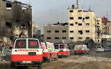 This handout photograph taken on February 18, 2024 by the World Health Organization shows a convoy of ambulances during a WHO, UN humanitarian agency OCHA and Palestinian Red Crescent mission to evacuate patients from Nasser hospital in Khan Younis in the southern Gaza Strip. (Christopher Black/WHO/AFP)