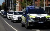 A police car leads a diplomatic motorcade past the venue for the 50th ASEAN-Australia Special Summit, which is being held at Melbourne Convention and Exhibition Centre from March 4th-6th 2024, in Melbourne on March 5, 2024. (Martin KEEP / AFP)