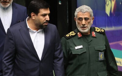 Iranian Quds Force commander General Esmail Qaani (R) arrives for the inauguration of new Iranian President Masoud Pezeshkian at the parliament in Tehran, on July 30, 2024. (AFP)