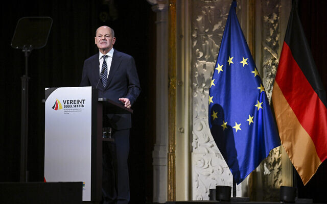 File: German Chancellor Olaf Scholz speaks at a ceremony to mark the 34th anniversary of Germany's Unification Day, at Mecklenburg State Theatre in Schwerin, Eastern Germany on October 3, 2024. (Annegret Hilse / POOL / AFP)