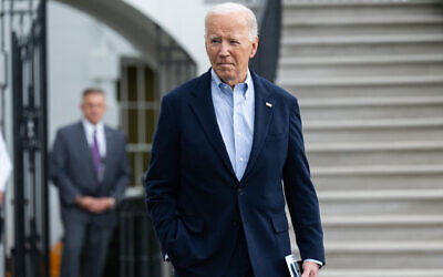 US President Joe Biden speaks to the media prior to departing on Marine One from the South Lawn of the White House in Washington, DC, October 3, 2024. (Saul Loeb / AFP)