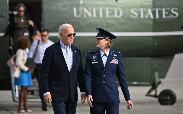 US President Joe Biden makes his way to board Air Force One with Colonel Angela F. Ochoa, Commander, 89th Airlift Wing before departing Joint Base Andrews in Maryland on October 3, 2024. (Mandel Ngan/AFP) US President Joe Biden makes his way to board Air Force One with Colonel Angela F. Ochoa, Commander, 89th Airlift Wing before departing Joint Base Andrews in Maryland on October 3, 2024. (Mandel Ngan/AFP)
