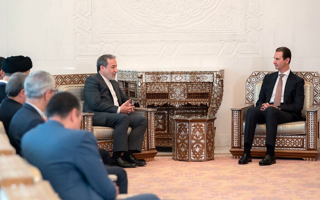 This handout picture released by the Syrian Presidency Telegram page shows Syria's President Bashar al-Assad (R) meeting with Iranian Foreign Minister Abbas Araghchi in Damascus on October 5, 2024. (Syrian Presidency Telegram Page/AFP)