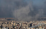 Smoke rises from the site of an Israeli airstrike that targeted Beirut's southern suburbs, on October 5, 2024. (Anwar Amro/AFP)