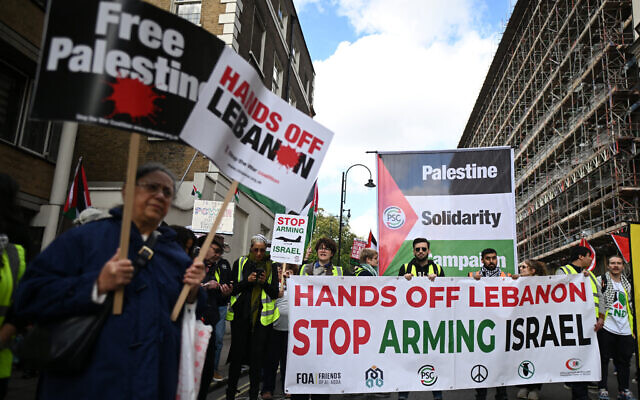 Illustrative: pro-Palestinian, anti-Israel activists and supporters wave flags and hold placards as they pass through central London, during a March for Palestine on October 5, 2024. (Justin Tallis / AFP) Illustrative: pro-Palestinian, anti-Israel activists and supporters wave flags and hold placards as they pass through central London, during a March for Palestine on October 5, 2024. (Justin Tallis / AFP)