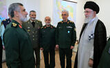 Iran's Supreme Leader Ayatollah Ali Khamenei (R) pictured with the Islamic Revolutionary Guard Corps' Aerospace Force Commander Brigadier General Amir Ali Hajizadeh (L) in Tehran on October 6, 2024, awarding him a medal for the Iranian attack on Israel. (KHAMENEI.IR / AFP)