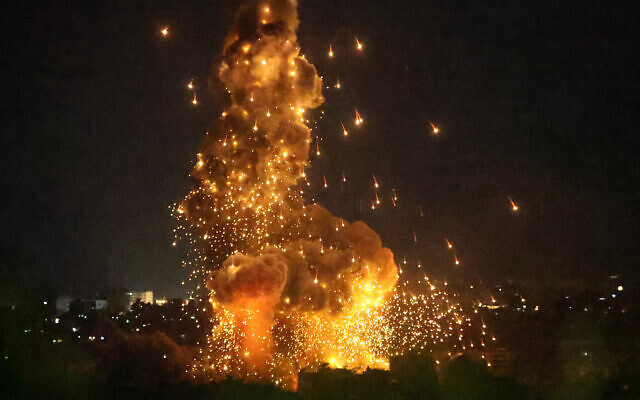 Smoke rises from the site of an Israeli airstrike that targeted a neighborhood in Beirut's southern suburb, on October 6, 2024. (STRINGER / AFP)