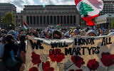 Pro-Palestinian, anti-Israel demonstrators rally on the Columbia University campus in New York City to mark a year since the Hamas terror group's onslaught on southern Israel that sparked the ongoing war in Gaza, October 7, 2024 (Alex Kent/Getty Images/AFP)