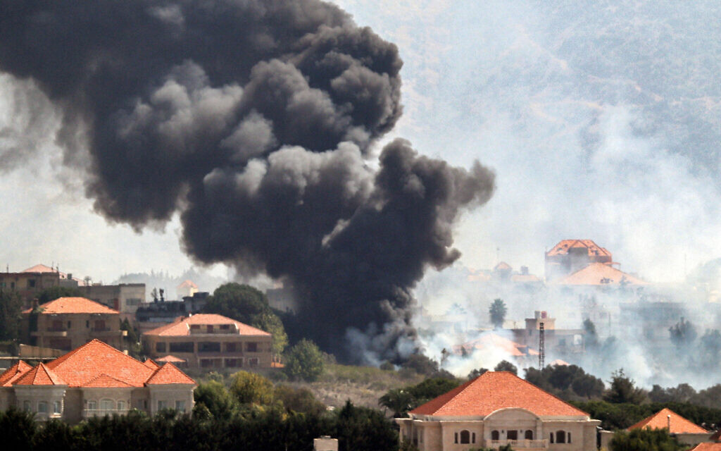 A plume of smoke billows following an Israeli air strike on the village of Khiam in southern Lebanon near the border with Israel on October 7, 2024.  (Photo by AFP)