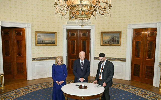 US President Joe Biden, First Lady Jill Biden, and Rabbi Aaron Alexander of Adas Israel Congregation mark one year since Hamas's attack on Israel during a candle lighting in the Blue Room of the White House in Washington, DC, October 7, 2024. (ANDREW CABALLERO-REYNOLDS / AFP) US President Joe Biden, First Lady Jill Biden, and Rabbi Aaron Alexander of Adas Israel Congregation mark one year since Hamas's attack on Israel during a candle lighting in the Blue Room of the White House in Washington, DC, October 7, 2024. (ANDREW CABALLERO-REYNOLDS / AFP)