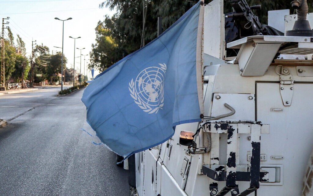 A United Nations flag flies in the back of one of the armored vehicles of the UN Interim Force in Lebanon during a patrol around Marjayoun in southern Lebanon on October 8, 2024. (AFP)