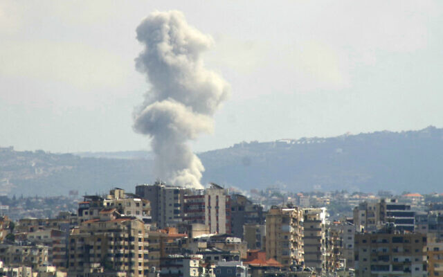 A picture taken from the southern Lebanese city of Tyre shows smoke rising from the site of an Israeli strike targeting the village of Qana on October 12, 2024. (Kawnat Haju/AFP)