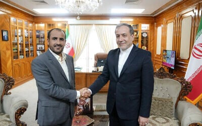 This handout picture provided by the Iranian foreign ministry shows Iran's Foreign Minister Abbas Araghchi (R) meeting with spokesman and chief negotiator of Yemen's Hםuthis Mohammad Abdelsalam in Oman's capital Muscat on October 14, 2024.(Photo by Iranian Foreign Ministry / AFP)