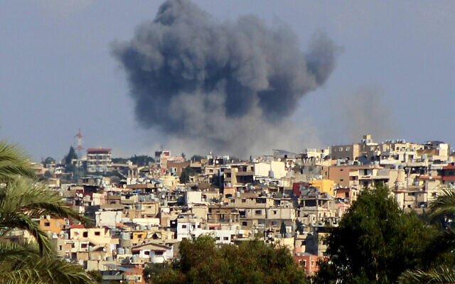 This picture taken from Lebanon's southern city of Tyre shows a smoke plume erupting following an Israeli air strike on the village of Tayrdebba on October 16, 2024. (Kawnat HAJU / AFP)