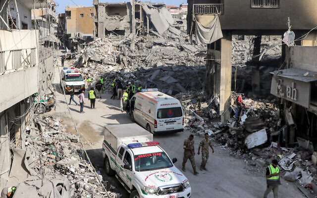 Civil defence rescue vehicles arrive at the site of an overnight Israeli air strike on the village of Qana in southern Lebanon on October 16, 2024. (Photo by Bilal KASHMAR / AFP) Civil defence rescue vehicles arrive at the site of an overnight Israeli air strike on the village of Qana in southern Lebanon on October 16, 2024. (Photo by Bilal KASHMAR / AFP)