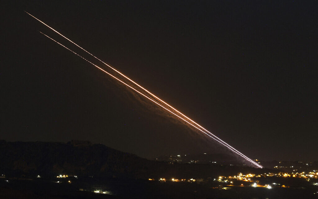 This picture taken in northern Israel, along the border with Lebanon, shows a barrage of rockets fired from a position near the southern Lebanese village of Khiam toward Israel on October 18, 2024. (Photo by Jalaa MAREY / AFP)