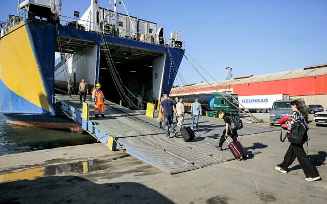 People evacuating from Lebanon board a ship bound for Turkey at the port of the northern city of Tripoli on October 19, 2024. (Photo by Ibrahim Chalhoub / AFP) People evacuating from Lebanon board a ship bound for Turkey at the port of the northern city of Tripoli on October 19, 2024. (Photo by Ibrahim Chalhoub / AFP)