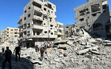 Palestinians inspect the damage after an Israeli airstrike the previous night in Beit Lahiya, in the northern Gaza Strip on October 20, 2024, amid the ongoing war between Israel and the Hamas terror group. (Islam Ahmed/AFP)