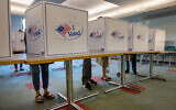 US voters fill out their ballots at the Stamford Government Center on the first day of early voting on October 21, 2024 in Stamford, Connecticut. (John Moore/Getty Images North America/Getty Images via AFP)