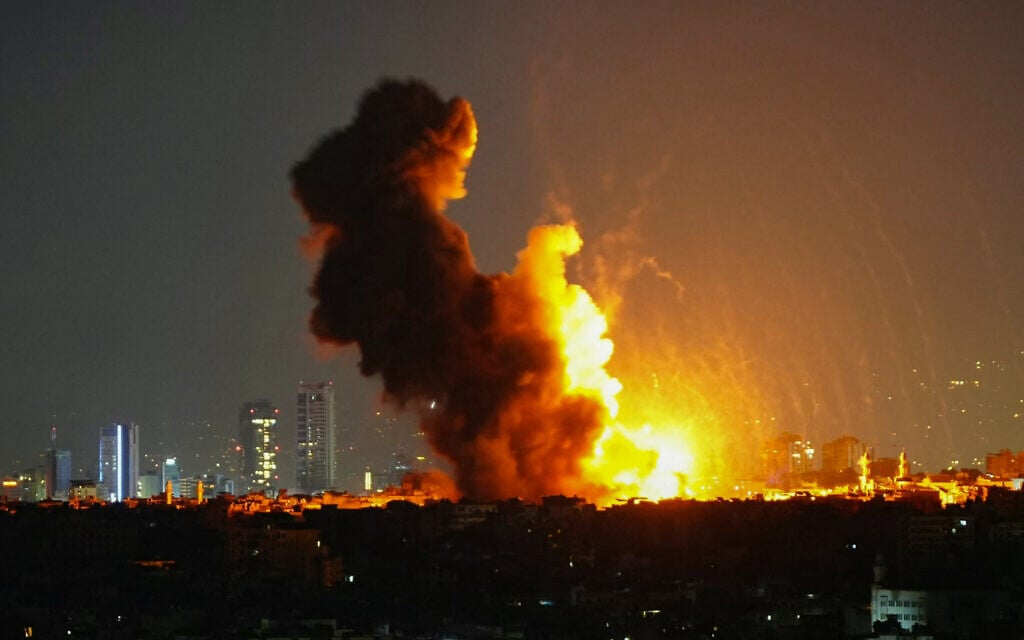 Smoke rises from the site of an Israeli airstrike that targeted a residential complex in the Leylaki neighbourhood in Beirut's southern suburbs on October 23, 2024. (AFP)