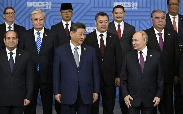 Egyptian President Abdel Fattah al-Sisi, Chinese President Xi Jinping, Russian President Vladimir Putin and other participants in the outreach/BRICS Plus format meeting pose for a family photo during the BRICS summit in Kazan on October 24, 2024. (Photo by Alexander NEMENOV / POOL / AFP) Egyptian President Abdel Fattah al-Sisi, Chinese President Xi Jinping, Russian President Vladimir Putin and other participants in the outreach/BRICS Plus format meeting pose for a family photo during the BRICS summit in Kazan on October 24, 2024. (Photo by Alexander NEMENOV / POOL / AFP)