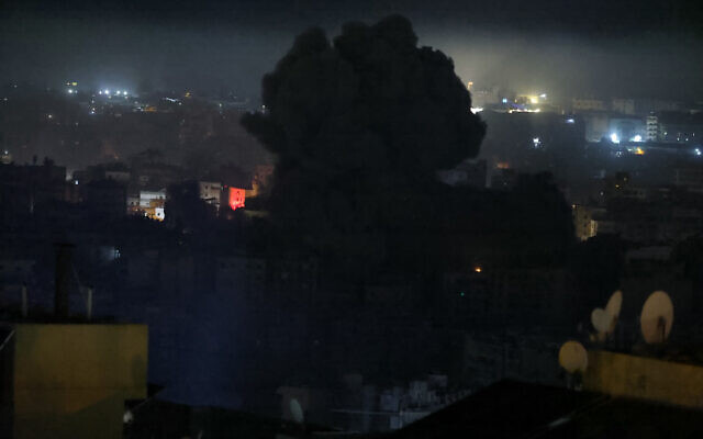 Smoke rises from the site of an Israeli air strike on a neighborhood in Beirut's southern suburbs on October 25, 2024. (Ibrahim Amro/AFP)