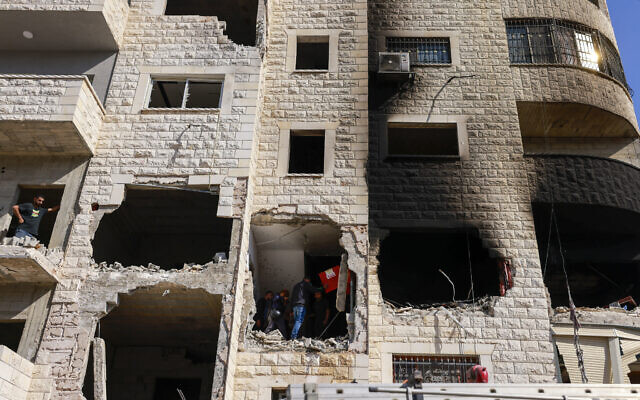 People inspect the damage following an Israeli counter-terror raid in Tulkarem in the West Bank on October 26, 2024. (Jaafar ASHTIYEH / AFP)