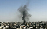 Smoke rises over Beit Lahiya, adjacent to Jabaliya in the northern Gaza Strip on October 26, 2024 (Photo by AFP)