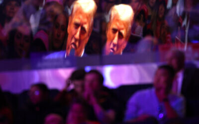 Republican presidential nominee and former US president Donald Trump is reflected off a window as he speaks at a campaign rally at Madison Square Garden on October 27, 2024, in New York City. (Michael M. Santiago/Getty Images/AFP)