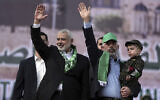 Head of the Hamas political bureau, Ismail Haniyeh (left) and Hamas leader in the Gaza Strip Yahya Sinwar (right) at a rally marking the 30th anniversary of the terror group, in Gaza City, December 14, 2017. (AP Photo/ Khalil Hamra)