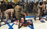 Popular Mobilization Forces burn representations of US and Israeli flags during al-Quds Day in Baghdad, Iraq, May 31, 2019. (AP Photo/Ali Abdul Hassan, File)