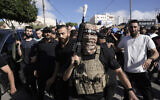 Gunmen attend the funeral of five Palestinians killed in an Israeli airstrike in the West Bank city of Tubas, September 5, 2024. (AP Photo/Majdi Mohammed)