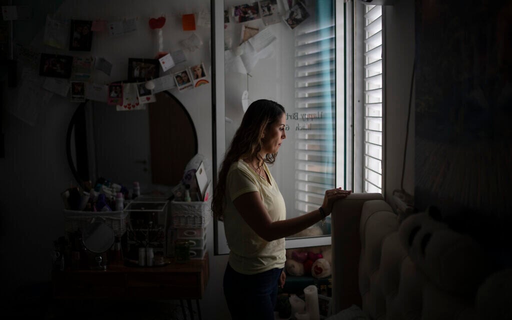 Lilach Almog talks about the Hamas attack on the police department in her city on October 7, 2023, during an interview at her apartment in Sderot, September 22, 2024. (AP Photo/Leo Correa)