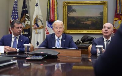 US President Joe Biden speaks during a briefing on the government's response to Hurricane Helene in the Roosevelt Room of the White House in Washington, Tuesday, Oct. 1, 2024, as Secretary of Transportation Pete Buttigieg, left, and Secretary of Homeland Security Alejandro Mayorkas, right, look on. (AP Photo/Mark Schiefelbein)