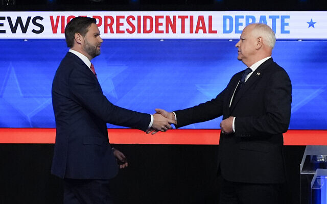 Republican vice presidential nominee Sen. JD Vance, R-Ohio, left, and Democratic vice presidential nominee Minnesota Gov. Tim Walz, shake hands as they arrive for a CBS News vice presidential debate, Tuesday, October 1, 2024, in New York. (AP Photo/Julia Demaree Nikhinson) Republican vice presidential nominee Sen. JD Vance, R-Ohio, left, and Democratic vice presidential nominee Minnesota Gov. Tim Walz, shake hands as they arrive for a CBS News vice presidential debate, Tuesday, October 1, 2024, in New York. (AP Photo/Julia Demaree Nikhinson)