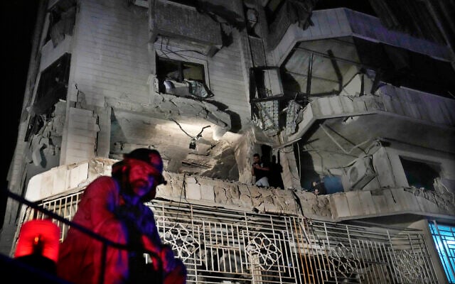 A firefighter stands in front of an apartment hit by an Israeli airstrike, in Beirut, Lebanon, October 3, 2024. (AP Photo/Hussein Malla) A firefighter stands in front of an apartment hit by an Israeli airstrike, in Beirut, Lebanon, October 3, 2024. (AP Photo/Hussein Malla)