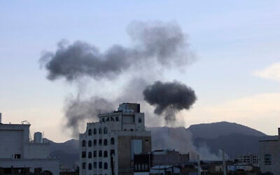 Smokes raise after US aircraft and ships struck Houthi strongholds, according to the official, in Sanaa, Yemen, October 4, 2024.  (AP Photo/Osamah Abdulrahman)
