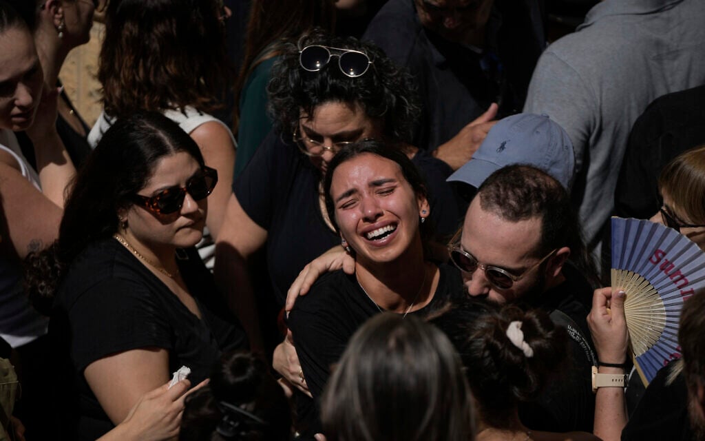 Mourners react during the funeral of Greek student Ionas Karousis, who was killed along with another six people in a terror attack in Jaffa at the Greek Orthodox cemetery in Jerusalem on Oct. 5, 2024. (AP Photo/Mahmoud Illean)