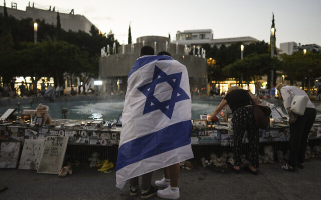 People look at a memorial for victims of the October 7 massacre by Hamas terrorists in southern Israel on the one-year anniversary of the attack, in Tel Aviv, on October 7, 2024. (Oded Balilty/AP)