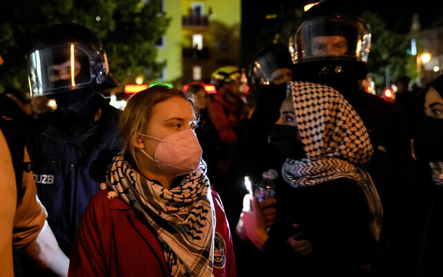 Activist Greta Thunberg, left, attends an anti-Israel rally in Berlin, October 7, 2024. (AP Photo/Ebrahim Noroozi) Activist Greta Thunberg, left, attends an anti-Israel rally in Berlin, October 7, 2024. (AP Photo/Ebrahim Noroozi)