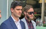 Jacob Hersant, left, a self-described Nazi, walks from the Melbourne Magistrates Court in, Melbourne, Australia, October 9, 2024. (AP Photo/Rod McGuirk)