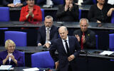 German Chancellor Olaf Scholz attends a special session of the German parliament marking the first anniversary of the October 7, 2023, Hamas massacre in Israel, at the German parliament Bundestag in Berlin, October 10, 2024. (AP Photo/Ebrahim Noroozi)